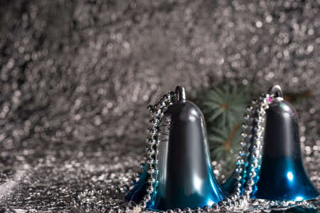 christmas bells on silver abstract bokeh background Christmas decorationの写真素材