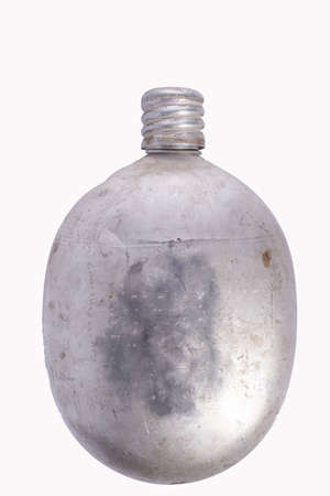 soldiers old flask on a white background and by the unscrewed lid soldiers old flask isolate on white backgroundの写真素材