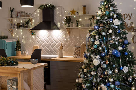 interior empty christmas kitchen with christmas tree, warm shade.の写真素材