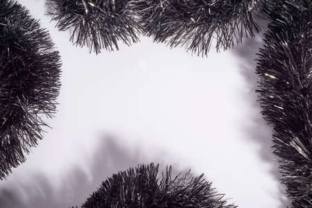 new year christmas black decorative shiny rain. On a white background. Christmas texture.
