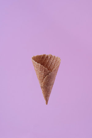 empty waffle ice cream cup on pink background minimalism.の写真素材