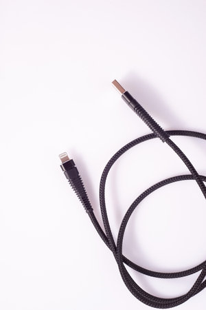 Cable connector micro-USB to USB on white background.の写真素材