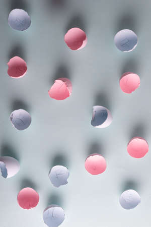minimalistic easter concept. Eggshell painted pink and blue, background.