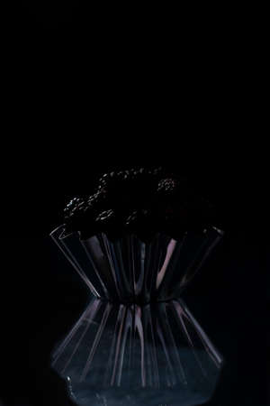 black berry on a black background in a rustic style.の写真素材