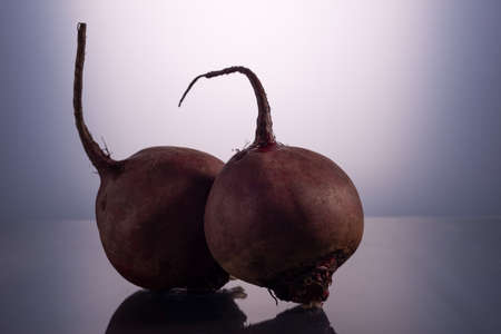 couple beets on white background, minimalistic still life.