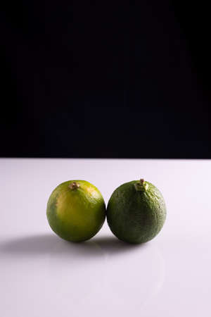 lime on a black and white background. Minimalist.の写真素材