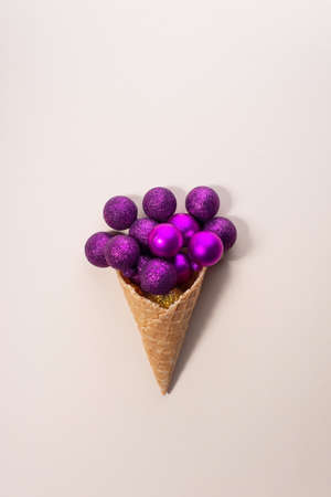 Christmas balls ice cream. Minimal concept on beige background.の写真素材