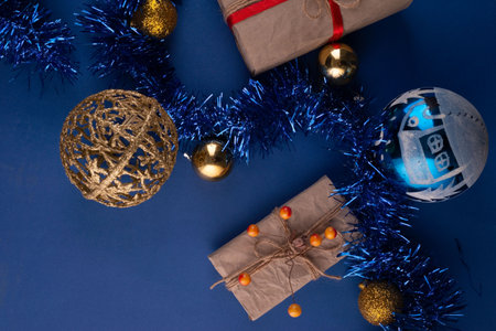 christmas flat lay on dark blue background with gifts.