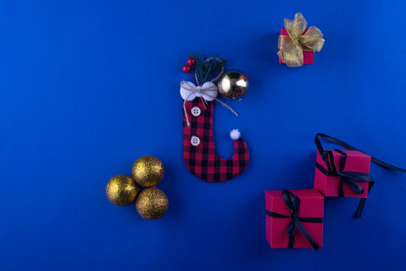 christmas composition minimalistic dark blue background with gifts and christmas decorations.の写真素材