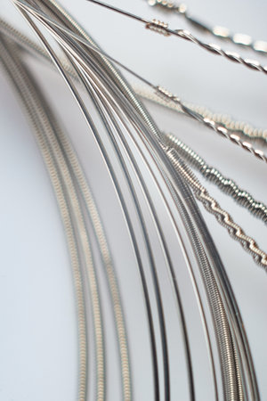 macro details of strings on a white background.