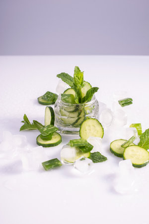 moisturizing cosmetics based on natural extracts of aloe, cucumber and ice in a glass container on a white background.の写真素材
