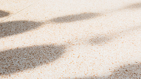 fragment of soft tile covering roof with granular texture and rounded edge lines in gray-red shade, background industrial textured surfaceの素材