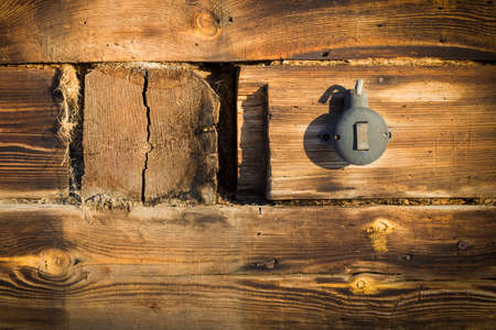 black plastic switch on an old wooden wallの写真素材