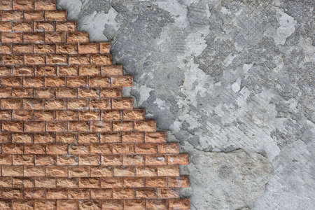 exterior decoration of the walls of the house with a brown stone, part of the stone fell awayの写真素材