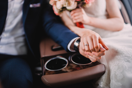 The man took the hand of a woman in the carの写真素材