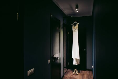Gorgeous wedding dress on a hangerの写真素材