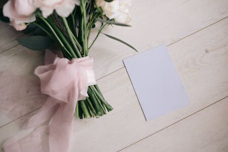 Wedding flowers with roses and a cardの写真素材