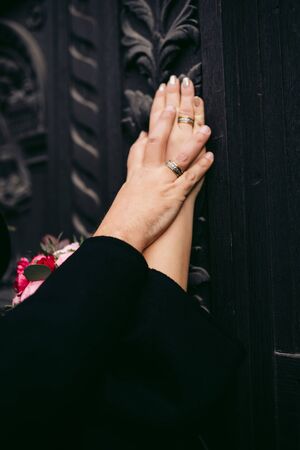 Newlyweds hands with wedding ringsの写真素材
