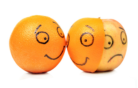 Apple and Orange emotions on white backgroundの写真素材