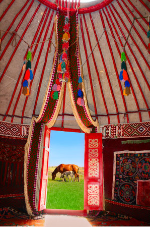 yurt, nomadic, interior, traditional, culture, horse, nature, travel, Kazakhstan, Kyrgyzstan, Central Asia, grassland, summer, tent, heritage, ethnic, design, carpet, pattern, rural, lifestyle, colorful, tourism, nomad, landscape, decoration, open door, blue sky, meadow, field, countryside, architecture, cultural, historical, handmade, wool, red, ornament, ethnic art, folklore, cozy, outdoor, freedom, nomadic life, local culture, eco tourism, adventure, pastoral, steppe, domestic, natural light,の写真素材