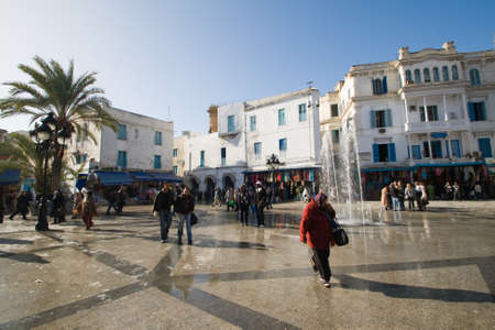 TUNIS - DECEMBER O4  A crowed of unidentified people walk at the  Place de la Victoire  on December 04, 2009 in Tunis  Place de la Victoire is the entrance to the medina in Tunis のeditorial素材