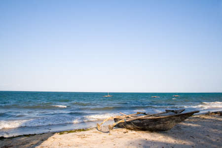 Small wooden boat at tanzanian coast の写真素材