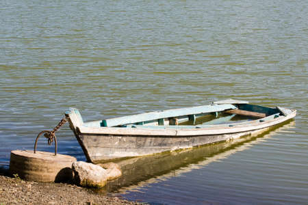Old boat on the lakeの写真素材