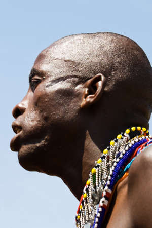 Closeup of a Masai warrior performing the traditional Masai dance in Masai Mara の写真素材