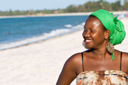Happy African woman looking to the sea の写真素材