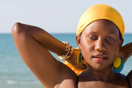 Portrait of an African woman in front of the sea 
