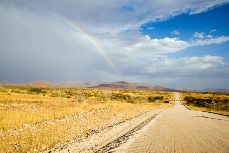 Rainbow over Namibian road.の写真素材