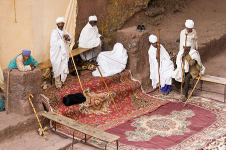 LALIBELA, ETHIOPIA - FEBRUARY 23, 2010: Unidentified priests pray in one of eleven monolithic rock-cut churches in Lalibelaのeditorial素材