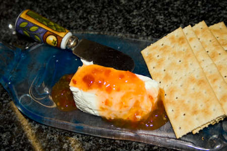 Cheese plate with chutney and crackers.の写真素材