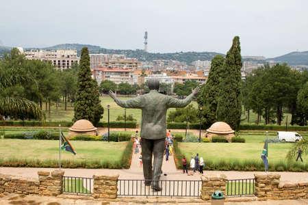 PRETORIA, SOUTH AFRICA - MARCH 22, 2015: Unidentified people take images of the nine metre tall bronze statue of former president Nelson Mandela of South Africa at the Union buildings in Pretoria. Nelson Mandela was the South Africaのeditorial素材