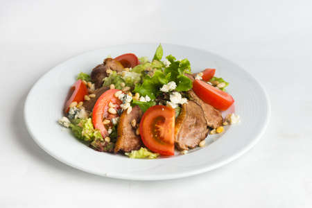 Plate of salad on white background.の写真素材