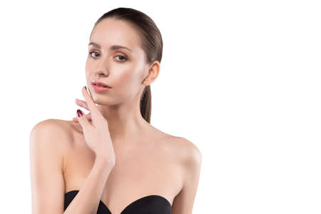 beauty female portrait with naked shoulders isolated on white.の写真素材