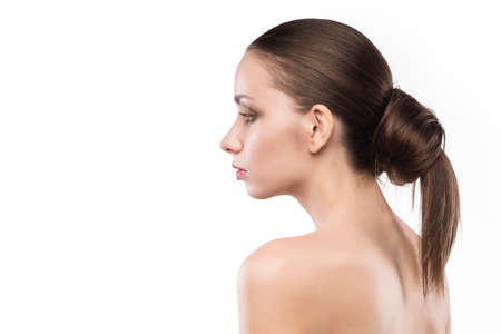 beauty female portrait with naked shoulders isolated on white.の写真素材