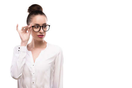 female portrait in glasses on a white background.の写真素材