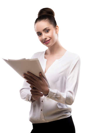 office girl holds papers in hands isolated on white.の写真素材