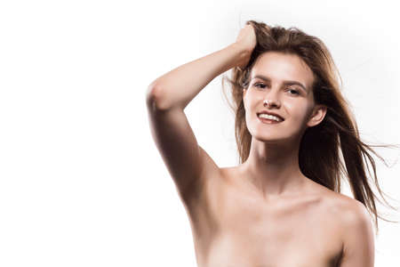 Potrtrait of young adult woman with clean fresh skin - isolated on whiteの写真素材