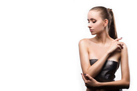 Portrait of beautiful young woman with clean, fresh skin on isolated white background. Cosmetology, beauty, misc. Copy spaceの写真素材