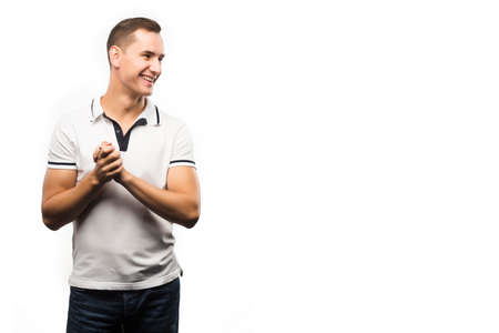 Young man wearing white polo shows sign shake hands Emotional, courageous face. Isolated on white background. Copy space..Advertising, fashion and commercial Design,の写真素材