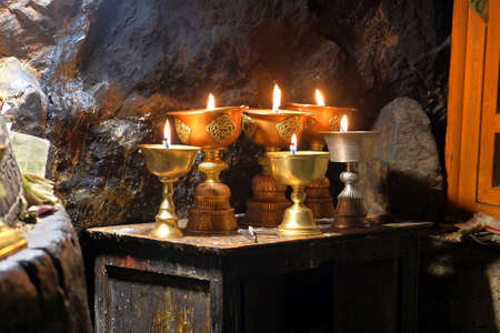 Burning candles at the RongPu Monastery, at the Everest Base Camp in Tibetの写真素材