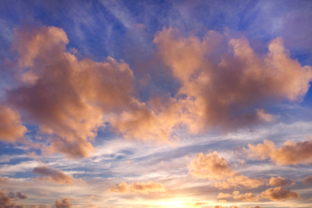 View from the coast of the Easter Island, of colorful sunset sky covered by white clouds, over the...