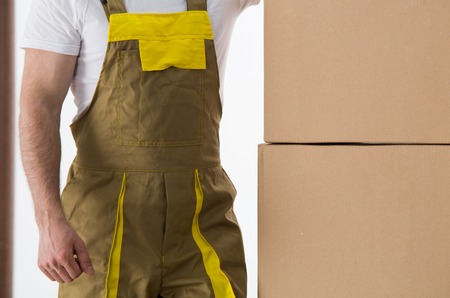 Worker with delivered boxes close-up view. Delivery and relocation service concept.の写真素材
