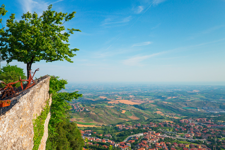 San Marino city view from above. Famous Italy destination. Copy space on blue sky background.の写真素材