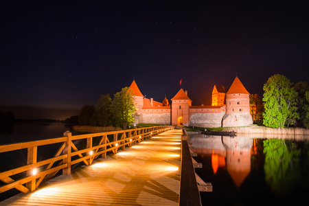 Lithuania. Trakai. Trakai castle with illumination at night. Lithuanian famous destination. Stunning night landscape with ancient castle.の写真素材