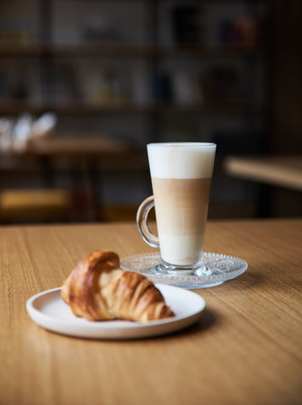 coffee and croissant on the coffee tableの写真素材