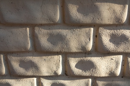 gray brick wall illuminated by soft light