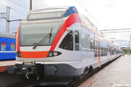 Modern high-speed comfortable train standing on the platform at the stationのeditorial素材